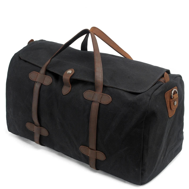 Grand sac de voyage en toile cirée et cuir noir