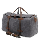 Grand sac de voyage en toile cirée et cuir gris