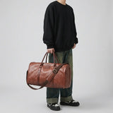 Sac de voyage vintage aspect cuir marron